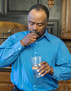 Man taking pills.